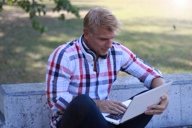 istock Mature blonde hair man working online 2151765512