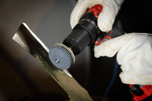 Sharpening lawnmower blade stock photo