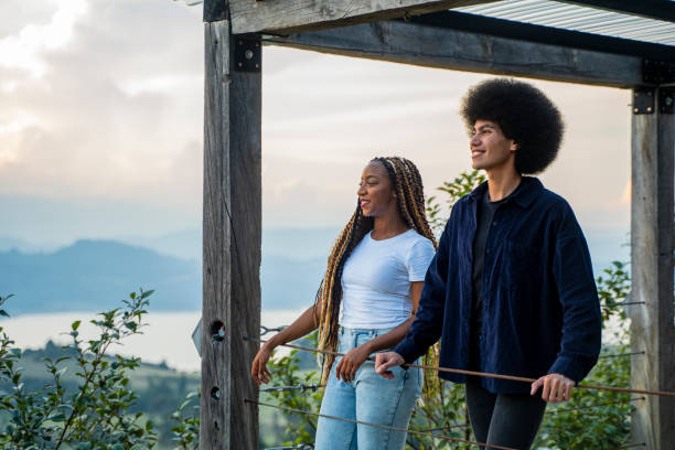 istock Couple looking at nature from a high balcony in tranquility 2151768539