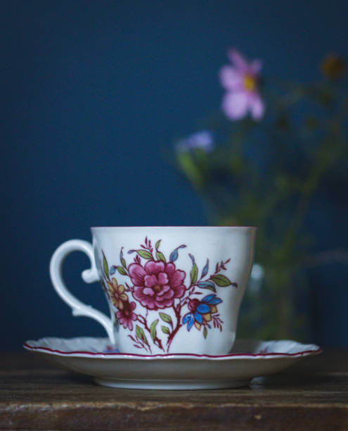 istock Vintage tea cup with flower print on wood surface 2151771288