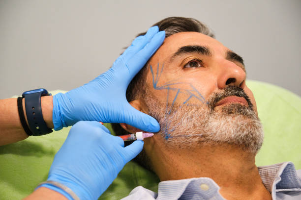 istock A man is getting a cheekbone filler or cheek Botox. 2151771664