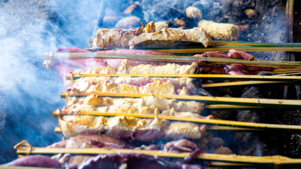 istock Baking and grilling marinated fish on a barbecue grill (grilled fish). Fish grilled over charcoal 2151771685