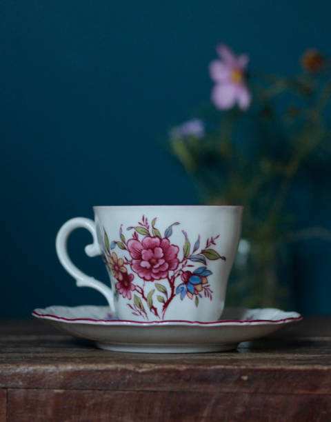 istock Vintage tea cup with flower print on wood surface 2151771969