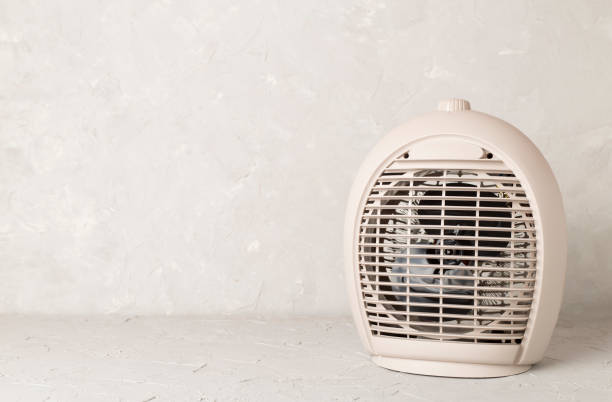 istock Portable electric heater on table 2151773272