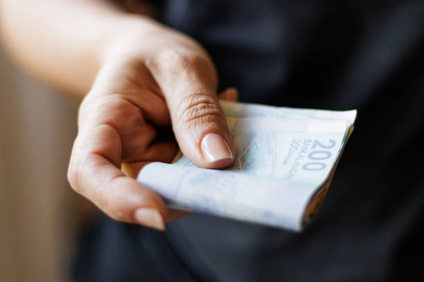 istock Hand holding Moroccan banknotes, dirham official currency of Morocco. 2151774638