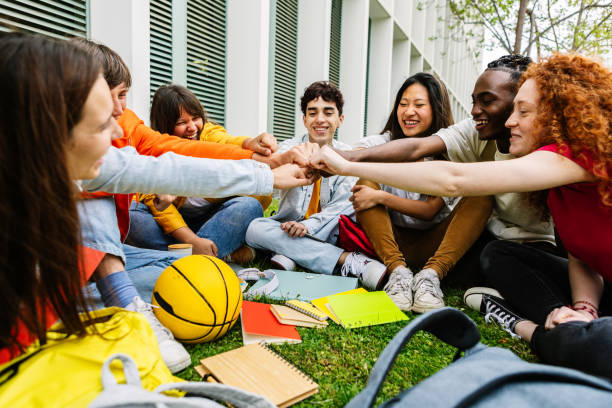 istock Young students people giving fist bump showing collaboration and teamwork 2151777317