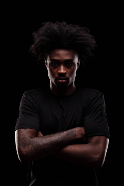 istock Serious concentrated african american man against dark background. 2151785960