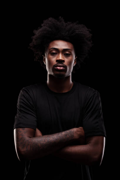 istock Serious concentrated african american man against dark background. 2151785967