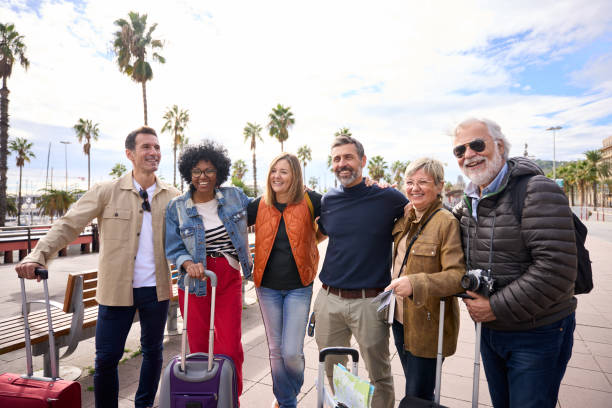 istock Group of smiling middle aged and diverse friends posing hugging and looking to side 2151790431