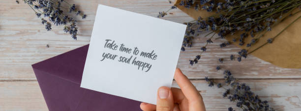 istock TAKE TIME TO MAKE YOUR SOUL HAPPY text on supportive message paper note reminder from green envelope. Flat lay composition dry lavender flowers. Concept of inner happiness, slowing-down digital detox personal fulfillment 2151791451
