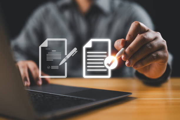 istock Businessman using electronic pen sign tick mark on virtual document for online approve paperless quality assurance and ERP management , Prepare check and approve concept. 2151803452
