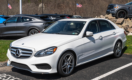Harmar Township, Pennsylvania, USA April 14, 2024 A used Mercedes Benz sedan for sale at a dealership on a sunny spring day