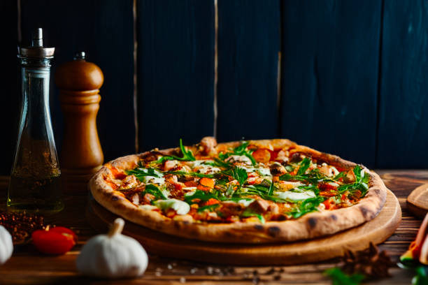 Italian Pizza Napoletana in Messy Kitchen with Cooking Ingredients