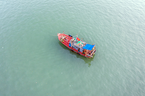 Fishing boat anchored in Halong Bay, Vietnam