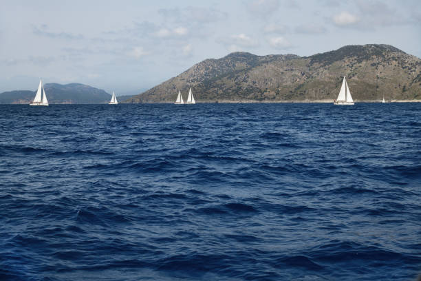 Sailing regatta in Turkey. Beautiful white yachts, sailboats or sail boats sailing at sea