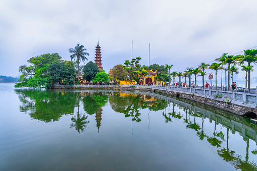 Hanoi, Vietnam - May 7th, 2024: Tran Quoc pagoda in early morning. This pagoda is located on a small island near the southeastern shore of West Lake. This is the oldest Buddhist temple in Hanoi.