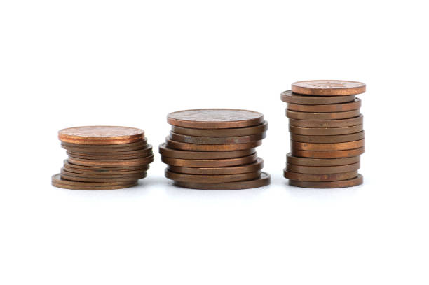 istock Stacks of coins ordered by size isolated on white 2151819550