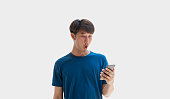 a-young-asian-man-in-his-20s-wearing-a-blue-t-shirt-is-excited-with-surprised-by-notification.jpg?b=1&s=170x170&k=20&c=8RtDcHXcvCZM79Yl3l8eczwd_hRY73oOZag-UDyDGqM=