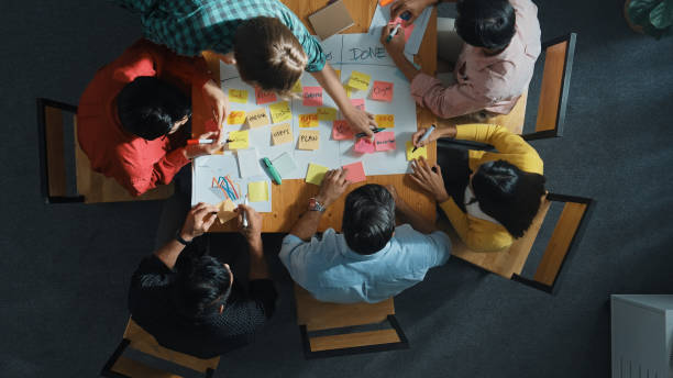 istock Top view of diverse people writing and making scrum task board. Convocation. 2151829675
