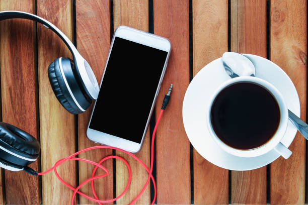 istock Smartphone, headphones with coffee espresso cup . 2151836060