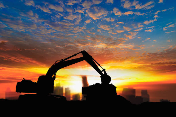 istock Crawler excavators silhouette are digging the soil in the construction site. 2151836092