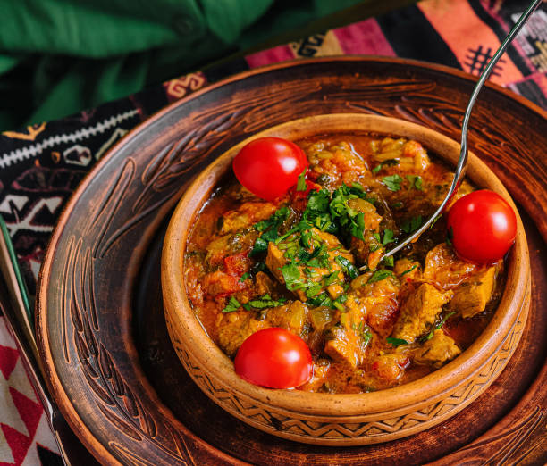 istock Traditional cuisine: woman enjoying savory stew 2151838139