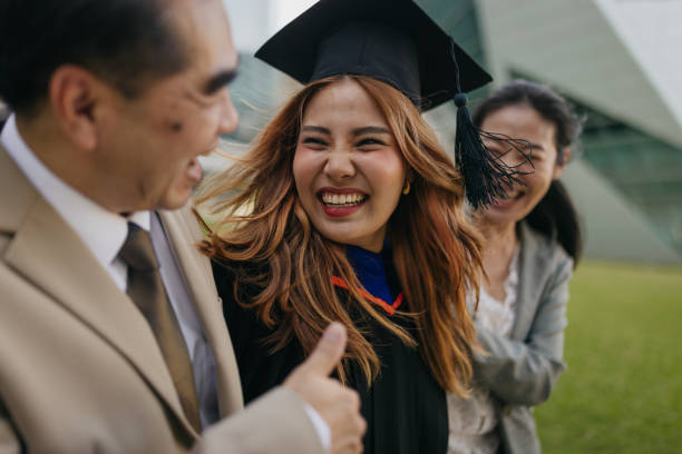 istock Proud parents with a graduated daughter 2151842252