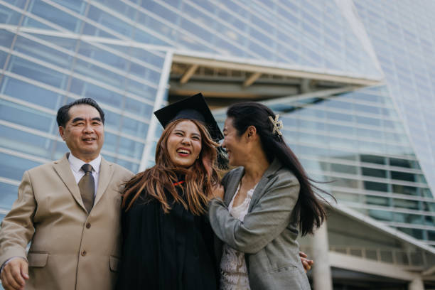 istock Proud parents with a graduated daughter 2151842257