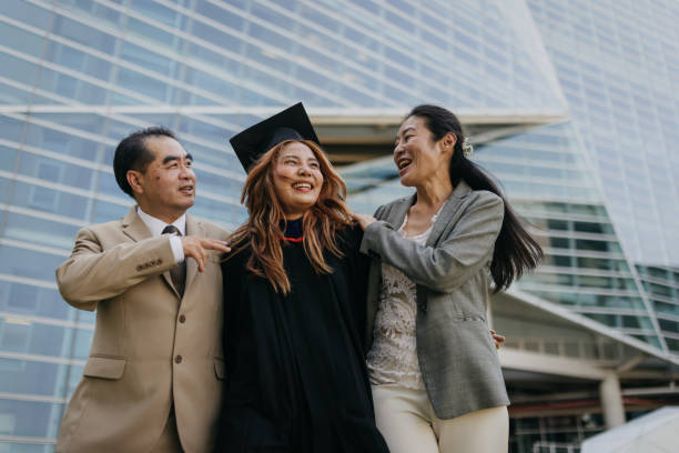 istock Proud parents with a graduated daughter 2151842261