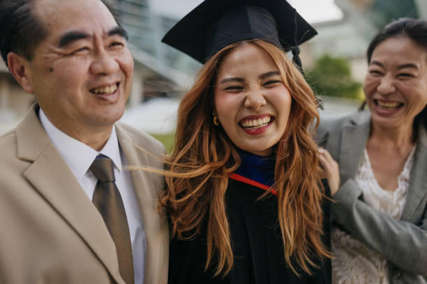 istock Proud parents with a graduated daughter 2151842268