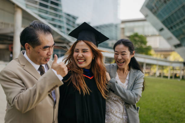 istock Proud parents with a graduated daughter 2151842270