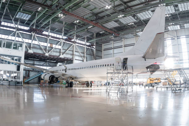istock White passenger plane in the aviation hangar 2151846124