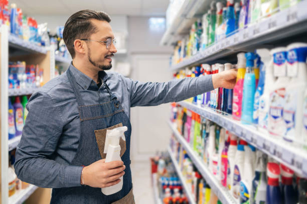 istock Business owner arranges products in the store 2151846194