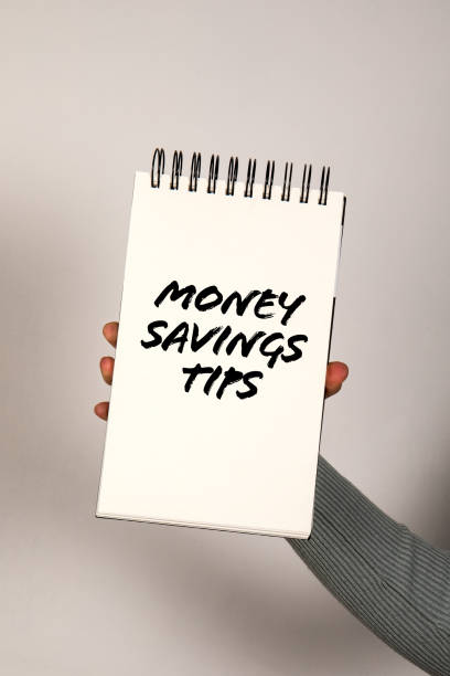 istock Money Savings Tips. Notepad with text in woman's hand 2151848254