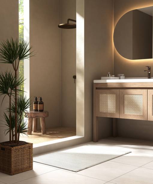 istock Luxury brown bathroom with shower enclosure, partition to vanity counter in sunlight from window on wall 2151848287