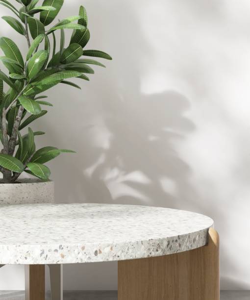 istock Minimal colorful terrazzo podium table, green tropical tree, in dappled sunlight, leaf shadow on white wall 2151848998