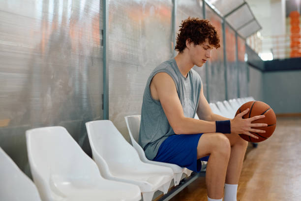College basketball player concentrating before the match.