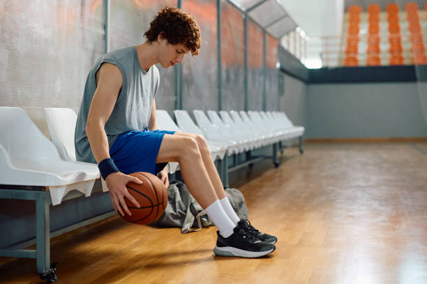 istock Young basketball player practicing with a ball during sports training. 2151849537