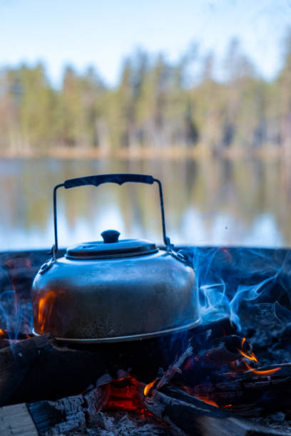 istock Camp kettle is heated on a bonfire. Hiking concept. 2151849864