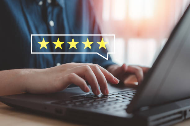 istock Customer satisfaction survey, online feedback rating and customer experience concept. Hand using computer laptop and giving 5 star for excellent service review. 2151851016
