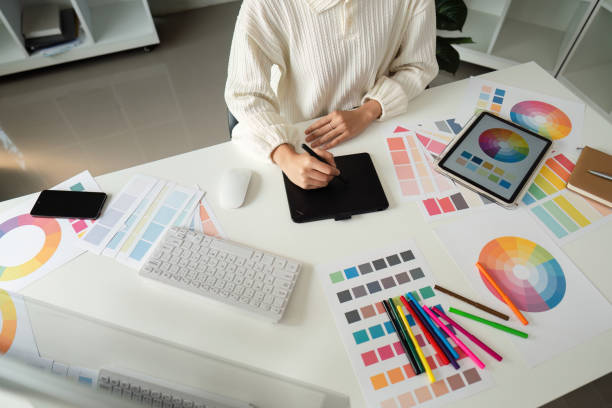 istock Graphic or UI designer work on computer laptop and with tablet after brainstorming unique design with professional developer UX team 2151851222