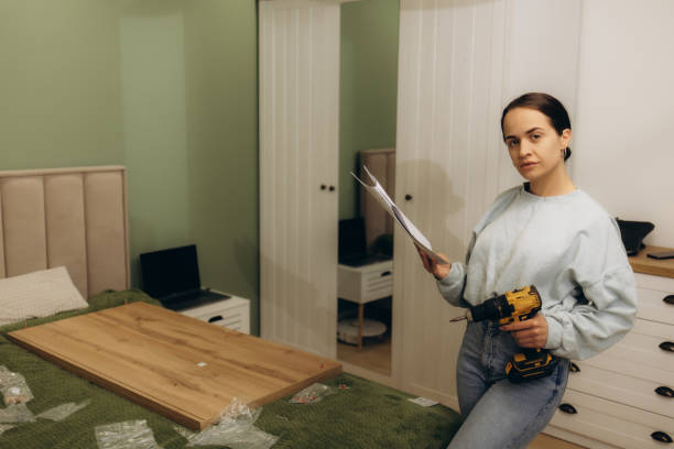 istock Stressed woman feeling frustrated and confused while reading the manual instructions to assembly furniture and do home improvements 2151853660