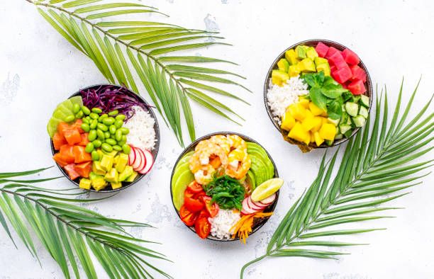 istock Poke bowls with vegetables and seafood set for balanced diet, white table background, top view 2151853889