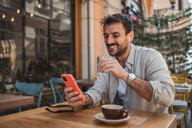 istock A modern young man in casual clothes is using a smartphone to chat with friends 2151854141