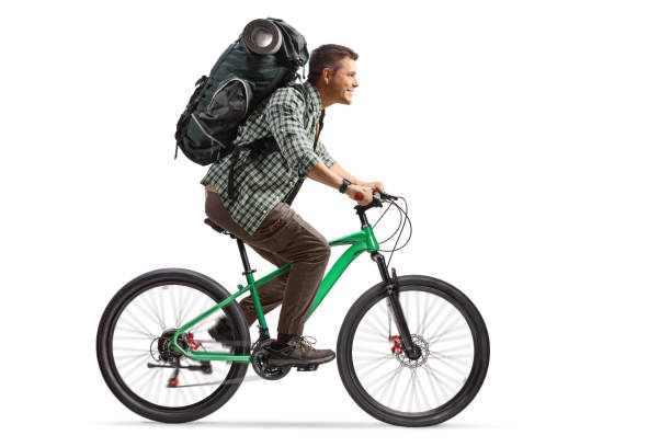 istock Full length profile shot of a man with a backpack riding a bicycle 2151855324