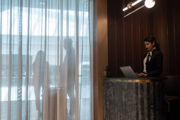 istock Airport lounge receptionist / hotel concierge busy at work 2151855694