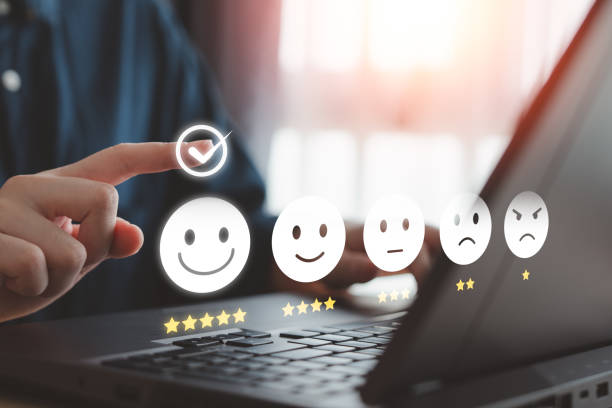 istock Customer satisfaction, online feedback rating and customer experience concept. User touch on virtual check mark for choosing happy smiling face with 5 star for giving best service by computer laptop. 2151855812