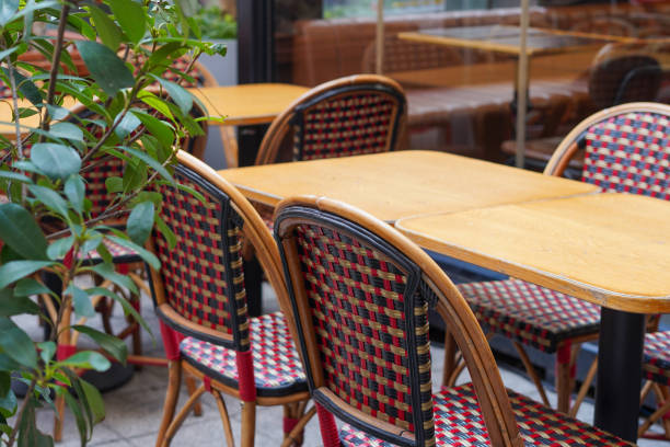 istock Outdoor empty restaurant terrace with potted plants tables and chairs 2151856027