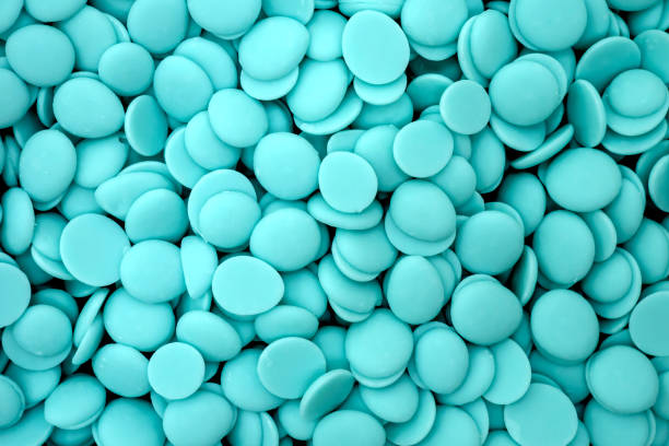 istock blue chocolate coating in the form of callets, chocolate drops 2151856308