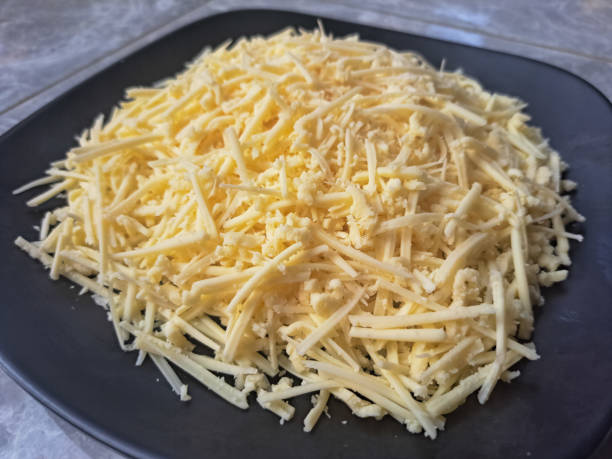 istock Grated Or Shredded Cheese On A Plate. Food Menu. 2151856697